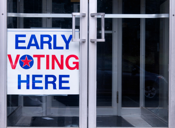 Early Voting An early voting sign on a storefront door.